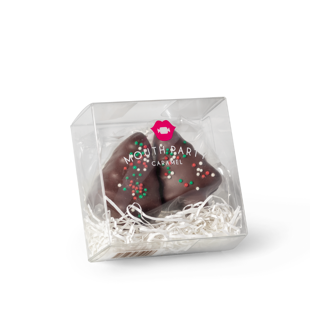 Two caramel trees blanketed with semi-sweet chocolate and adorned with holiday sprinkles packaged ready for gifting from Mouth Party Caramel